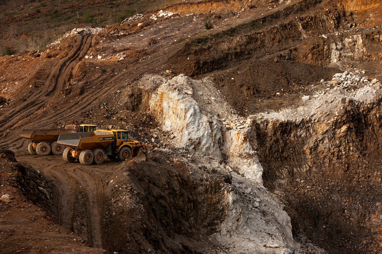 a large truck driving down a dirt road